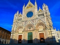 The facade of the Cathedral of Siena, Italy